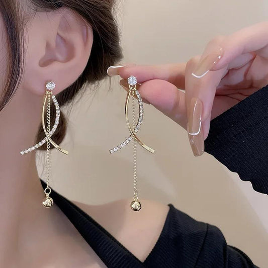 Criss cross tassel drop earrings